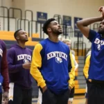 Kentucky basketball team wearing School Spirit Builders custom warm-ups during basketball season showcasing team unity and school spirit on court